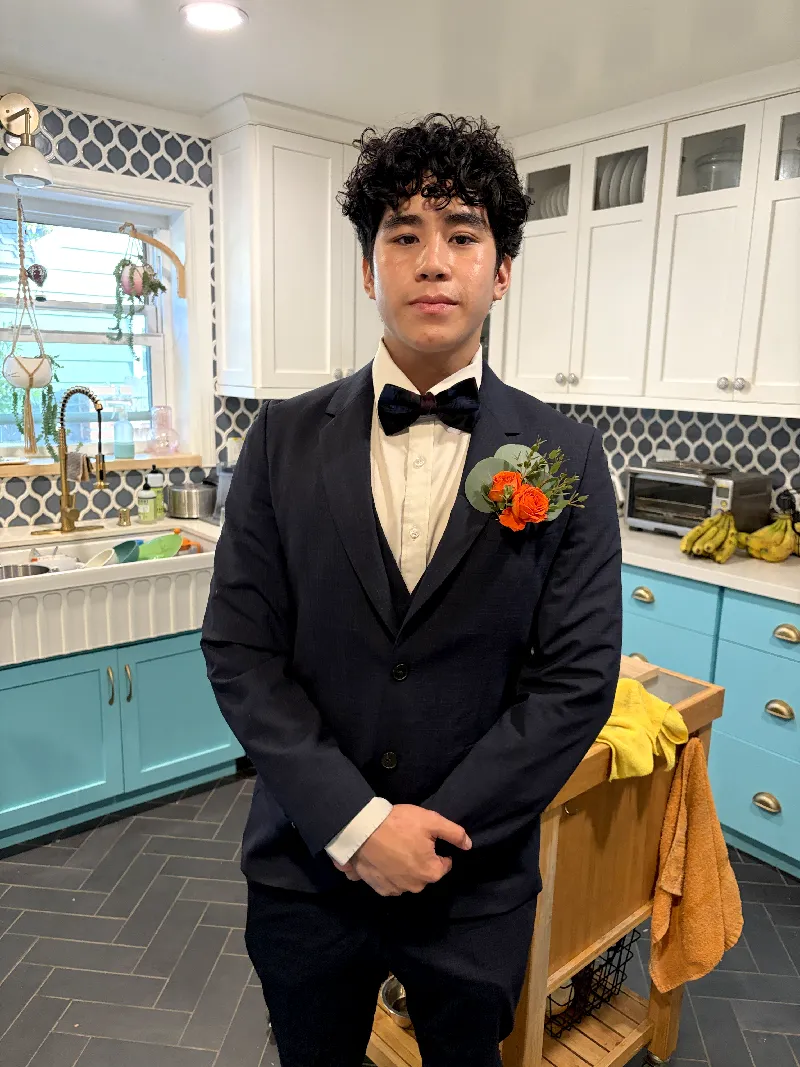 Elan Martinez dressed for a formal event